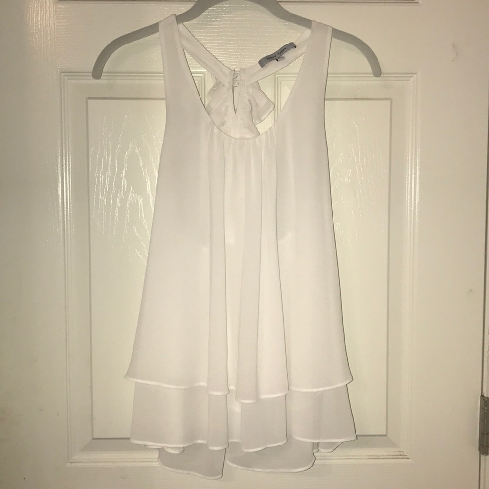 Beautiful white blouse with pretty opening in back